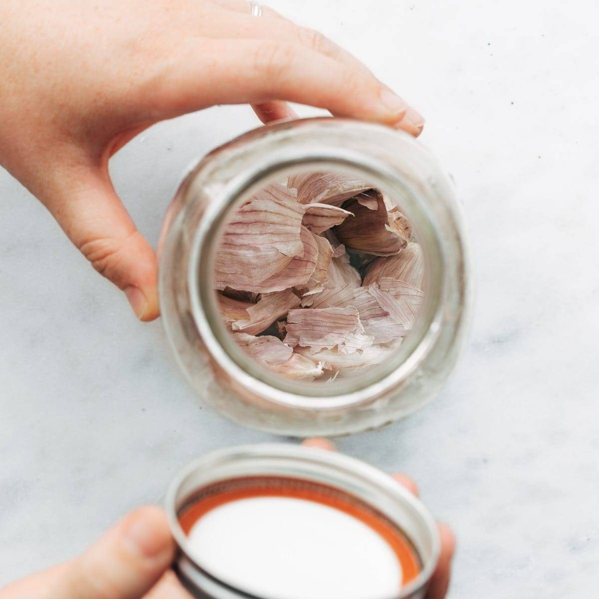 A person pouring out of a jar.
