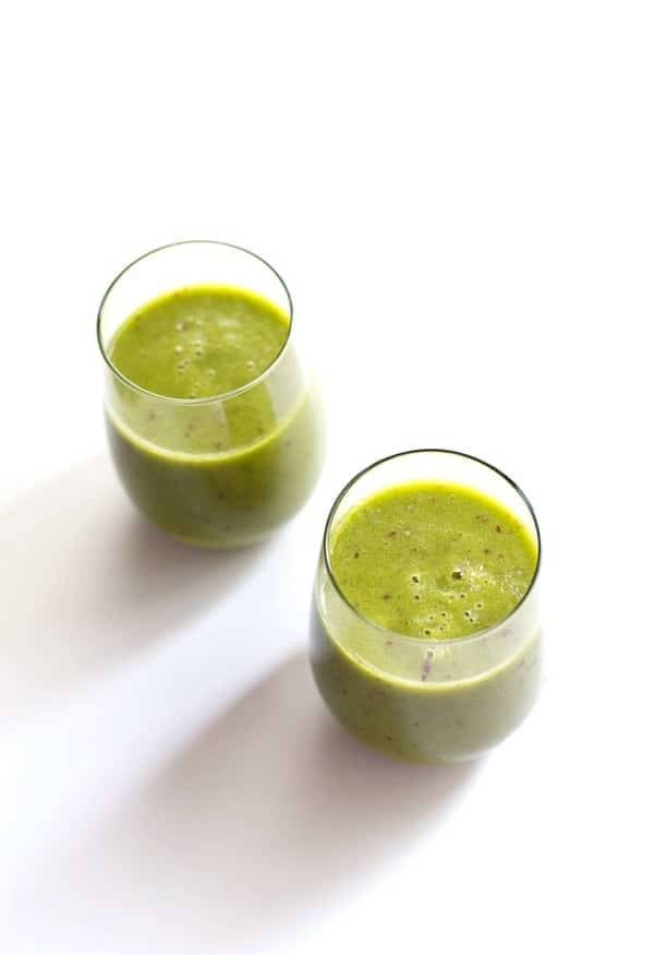 Peach green smoothies in glasses.