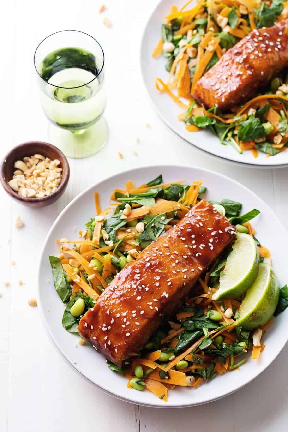 Glazed Salmon on top of green salad.
