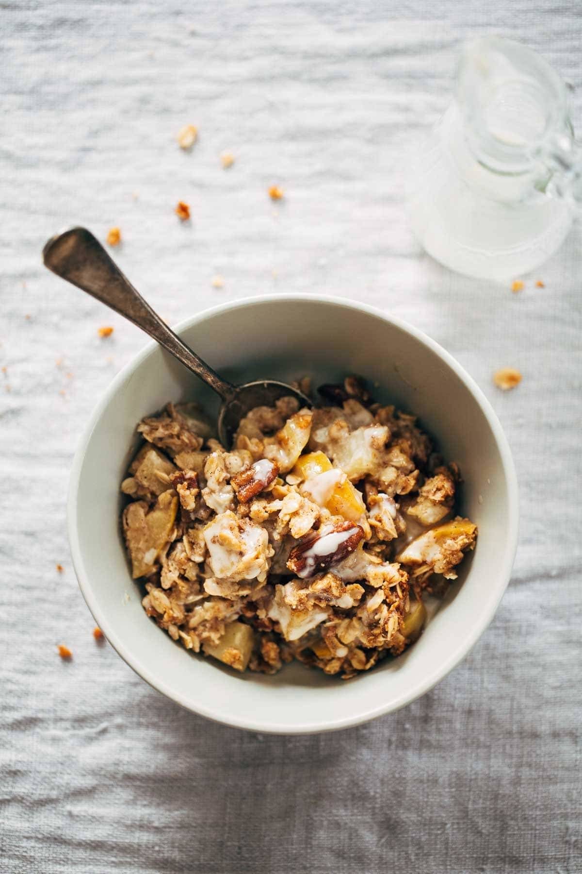 Coconut Oil Apple Crisp in a bowl with a spoon.