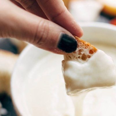Cheese Fondue with bread dipped in.