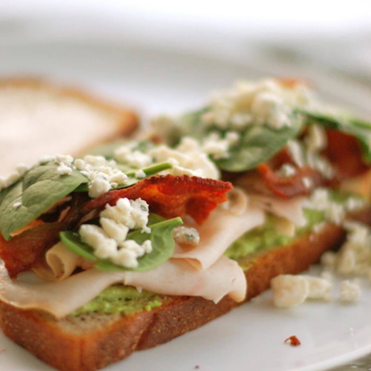 Gorgonzola and bacon panini with spinach and cheese crumbles.