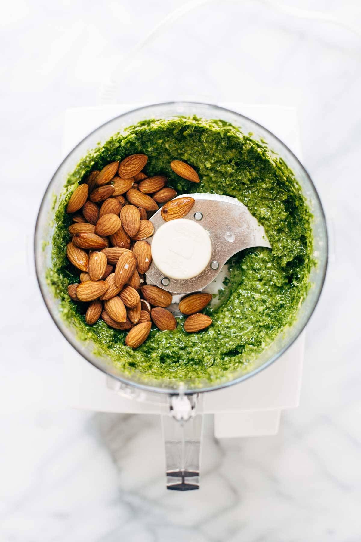 Kale pesto and almonds in a food processor.