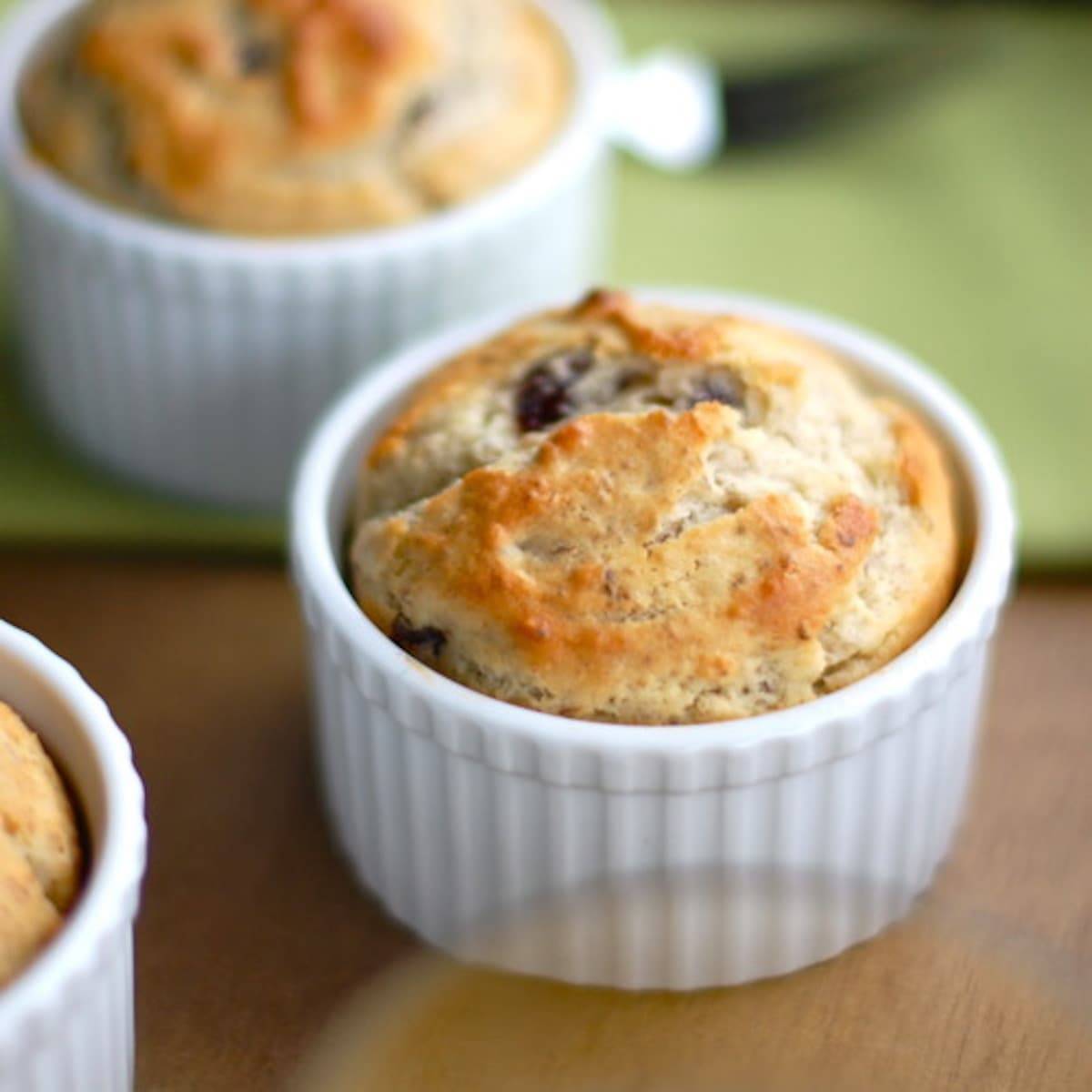 Strawberry breakfast cakes in white dishes.